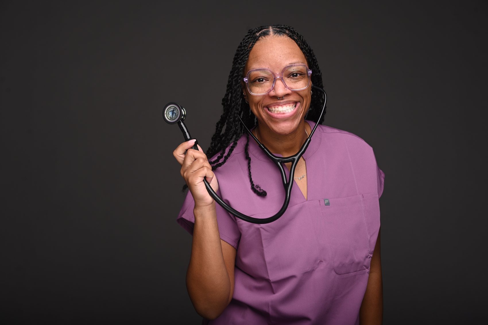 Dr. DeVontee' D. Rayford in scrubs
