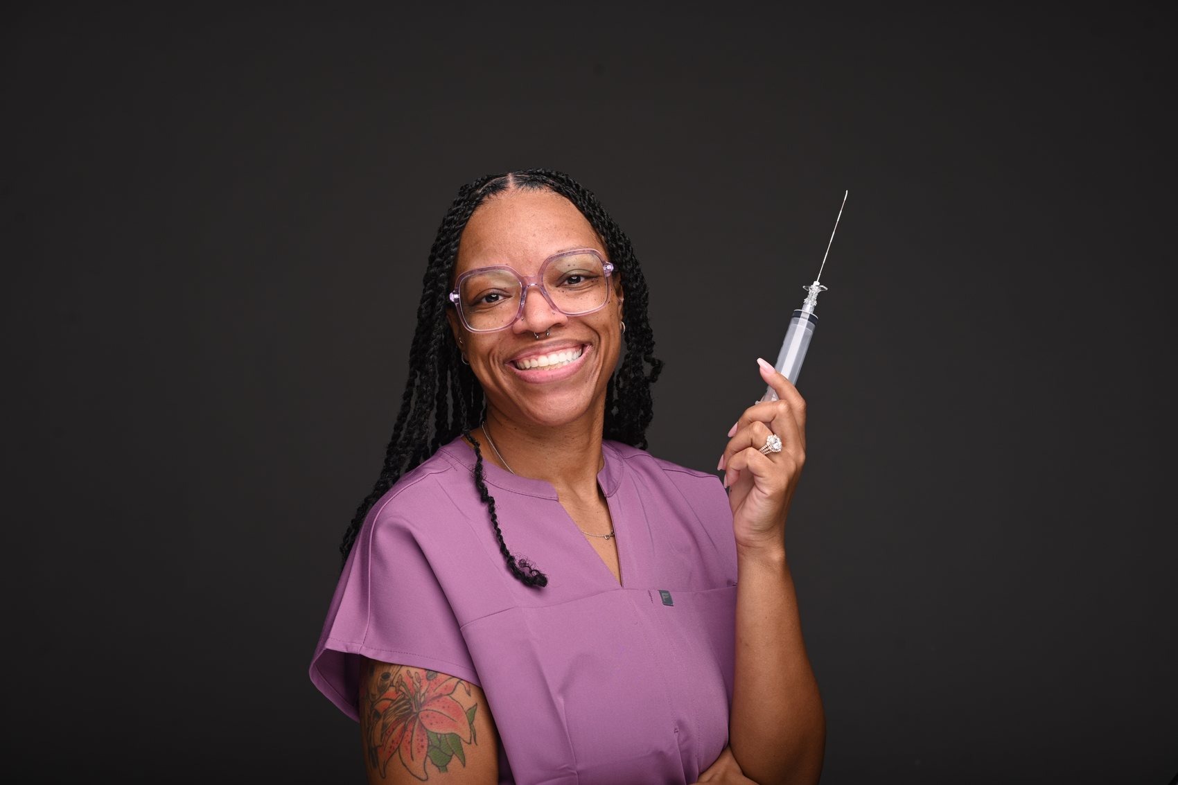 Dr. DeVontee' D. Rayford, DNP, CRNA, in scrubs
